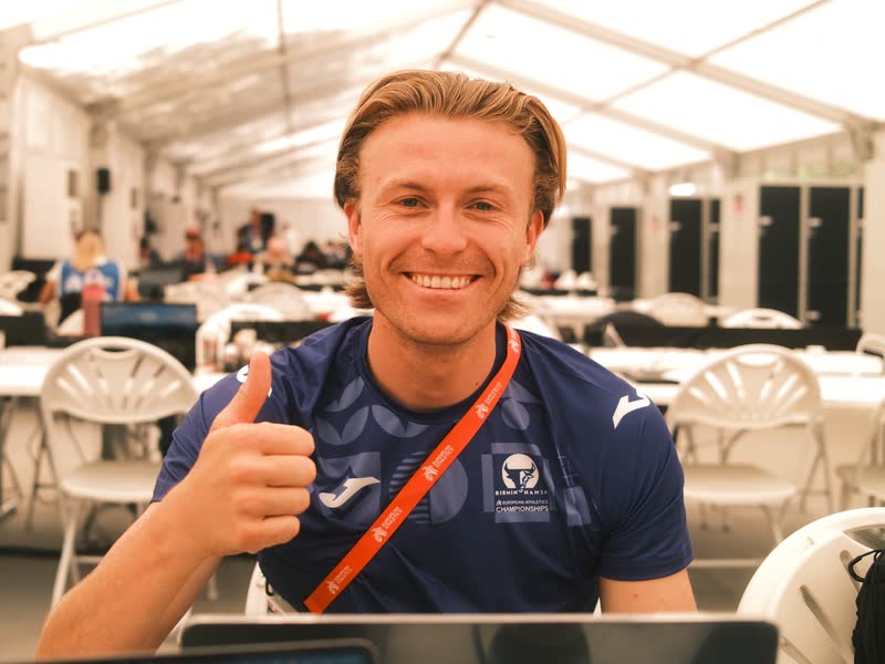 Lloyd at his laptop in the media centre at the Birmingham 2026 European Athletics Championships