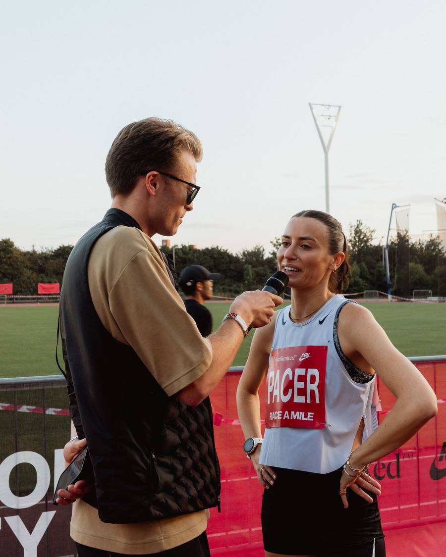Lloyd interviewing a runner at a Nike mile race