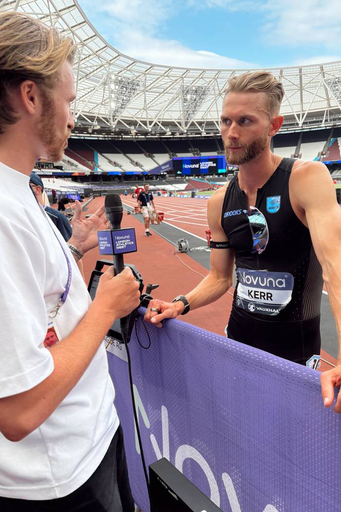 Lloyd interviewing Josh Kerr trackside at London Stadium